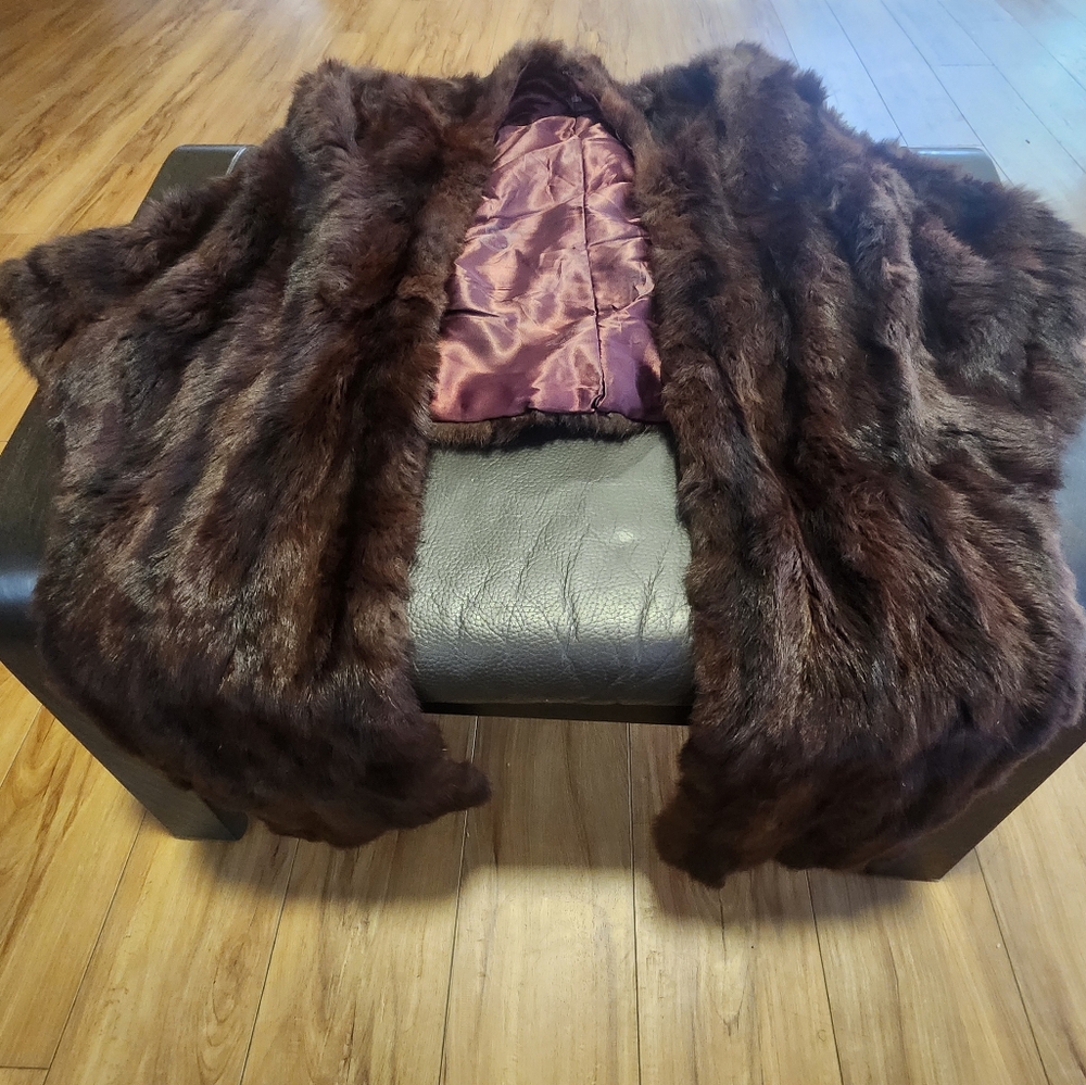 Pre-owned,  but very good condition women's fur shawl.